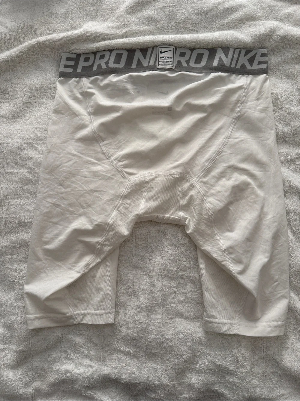 Nike White Pro Compression Shorts with Gray Waistband and Black Swoosh